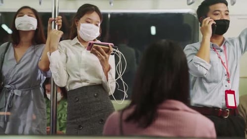 Crowd of People Wearing Face Mask on a Crowded Public Subway Train Travel