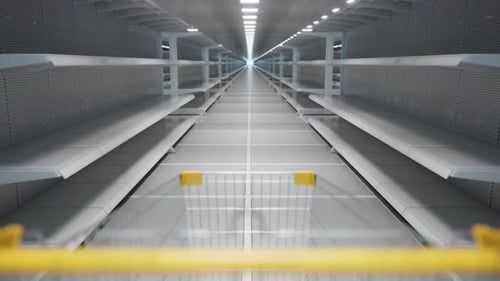 Trolley going along an aisle with long rows of empty store shelves in the store.