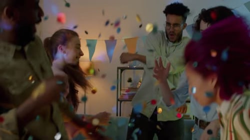 Friends Dancing with Confetti at Birthday Party
