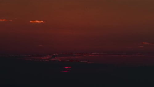 Time Lapse of Sun Rising Over Clouds