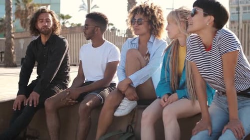 Content Young Friends Chilling on City Seafront