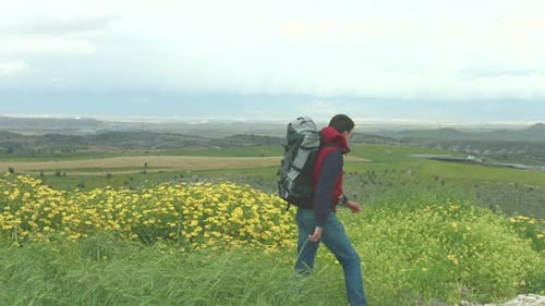 Young Man Backpacking, Enjoying Beautiful Panorama of Green Mountain Landscape