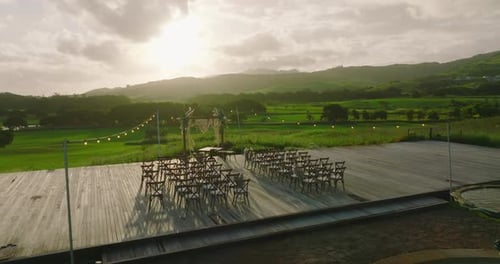 Romantic Wedding Venue Overlooking Lush Green Hills at Sunset