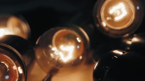 Close Up of Christmas Garland with Transparent Light Bulbs in Stock Warehouse