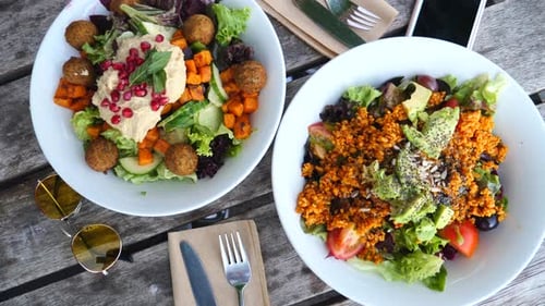 Vegan Salad With Falafel, Vegetables And Avocado On Wooden Background, Top View. Vegan Diet Food