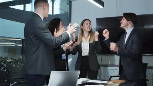 Successful Business Team Celebrating Victory in Office