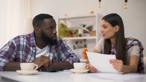 Multiracial Family Calculating Budget, Woman Upset With Unnecessary Purchase