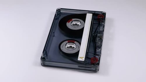Vintage Compact Cassette Tape Rotating on White