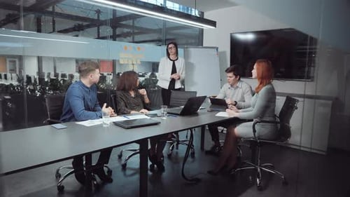 Manager Reporting During Business Meeting in Office