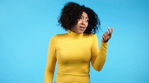 Young African Woman Showing Difference Between Invisible Abstract Subject or Object Sizes