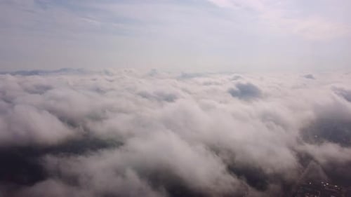 Aerial Perspective View of Flying Over Clouds