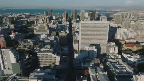 Aerial Shot of City Centre and Sea Bay in Background