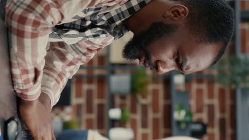 Vertical Video Portrait of Programer Typing Programming Code on Computer Keyboard Turning Head and