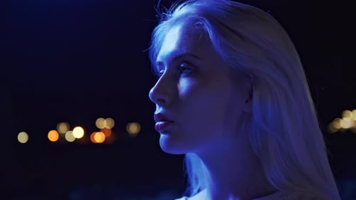 Portrait of Lovely Young Woman on the Streets of the Evening City Billboards and Neon Signs