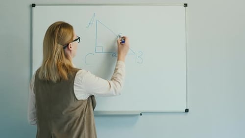 The Teacher Leads a Geometry Lesson for Younger Children.