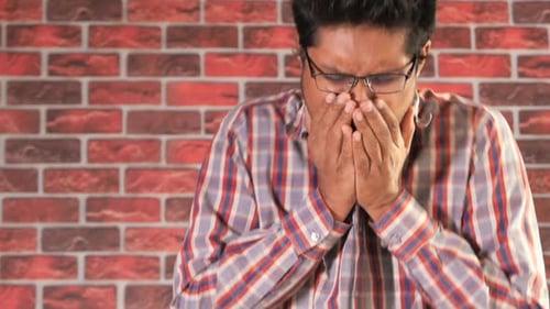 Young Asian Man Coughing and Sneezes Close Up