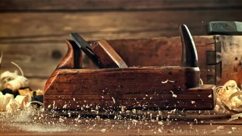 A Planer Falls on a Table with Shavings