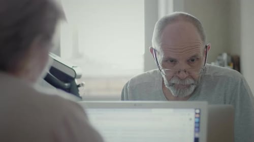 A Senior Man Working Remotely At Home