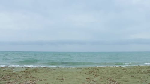 Young Lady in Sportswear Running on the Beach, Taking Care of Body and Health