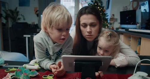 Woman and Children with Tablet at Home