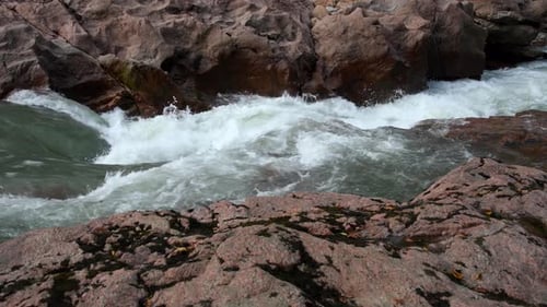 Mountain river among granite stones