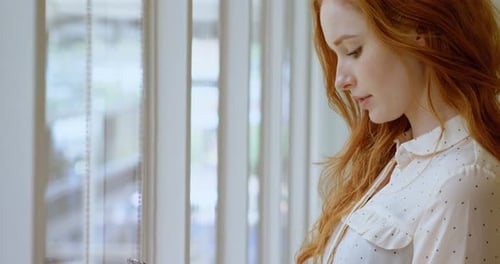 Female Executive Using Digital Tablet in Office