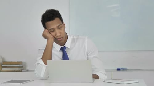 Tired Afro-American Businessman Sleeping at Work
