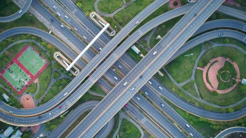 4K : Aerial Hyper lapse drone view of road junction with moving cars.