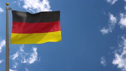 German National Flag Waving Realistically in Blue Sky