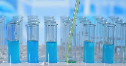 Lab Biochemist Dripping Oil Into Test Tube with Plant, Organic Cosmetology Study.