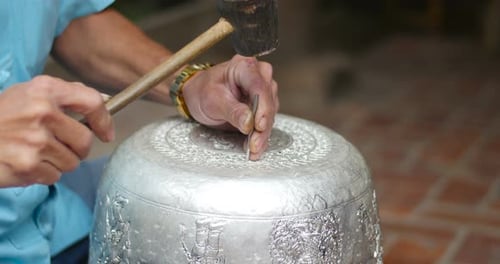 Silver Bowl Being Crafted with Hammer and Mallet