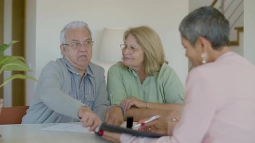 Senior Couple Meeting Consultant in Bright Home