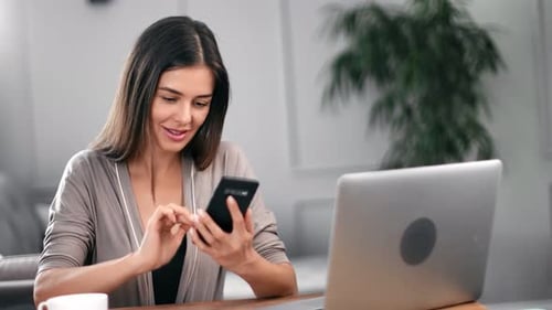 Pleasant Female Chatting Use Smartphone at Home Office Workplace