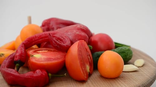Fresh Vegetables on Wooden Board in Bright Daylight