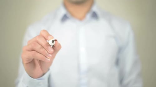 Person Writes Time to Relax on Glass Surface