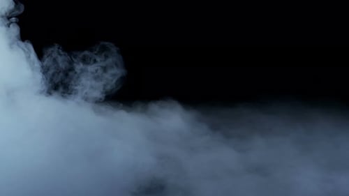 Abstract Slow Moving Smoke on Black Background