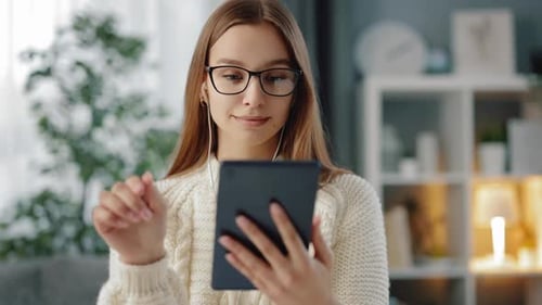 Young Woman Using Tablet at Home
