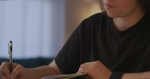 Woman Is Writing in Notebook Viewing Webinar at Screen of Laptop Online Lecture Selfeducation and