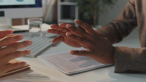 Business Hands Shake over Contract in Office