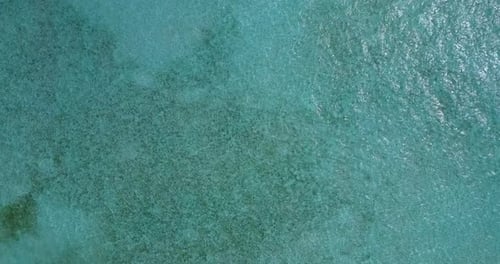 Natural overhead clean view of a summer white paradise sand beach and aqua blue water background