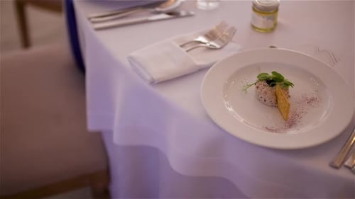Dinner Plate with Food and Silverware on Table