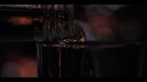 Liquor Being Poured Into a Glass Close Up