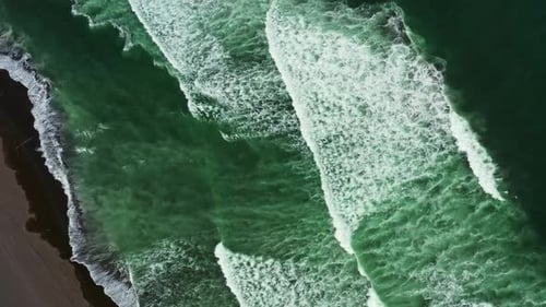 Aerial Top View of Beach with Black Sand