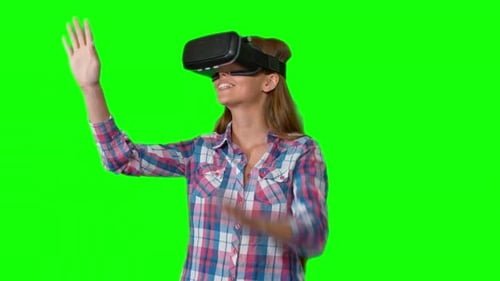 Woman Using Virtual Reality Headset on Green Screen