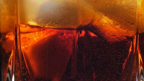 Soda with Ice Cubes in a Glass