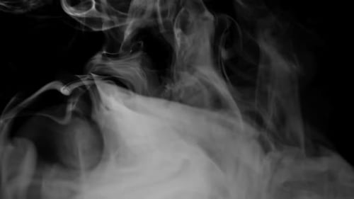 White Billowing Smoke Effect on a Black Background