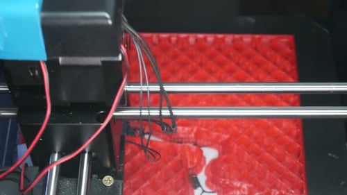 3D Printer Creating Red Grid-Patterned Object