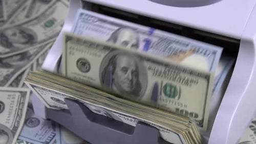 Cash Counting Machine With Stack of Money