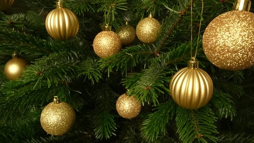 Golden Christmas Ornaments on Decorated Christmas Tree