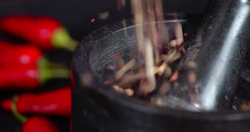 Mixed Peppercorns Poured into Mortar and Pestle